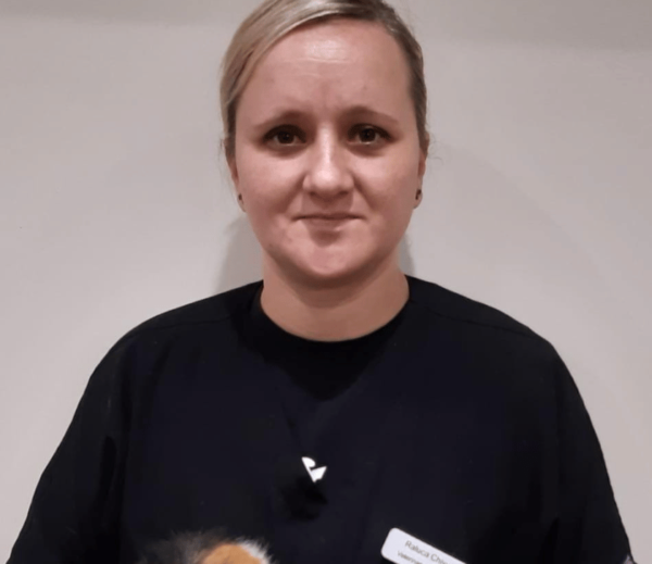 Image shows female vet smiling at Chorley vets
