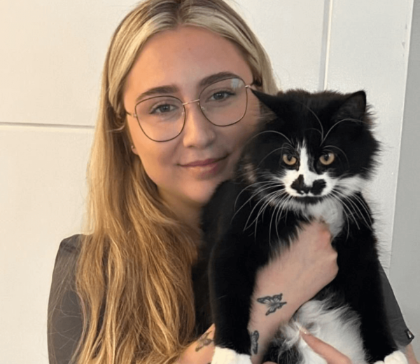 Alana May a Receptionist/Auxiliary Assistant at Chorley Vets holding a cat