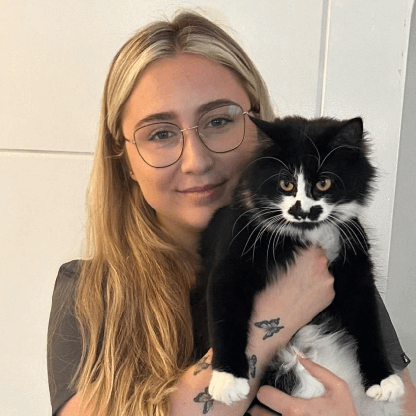 Alana May a Receptionist/Auxiliary Assistant at Chorley Vets holding a cat