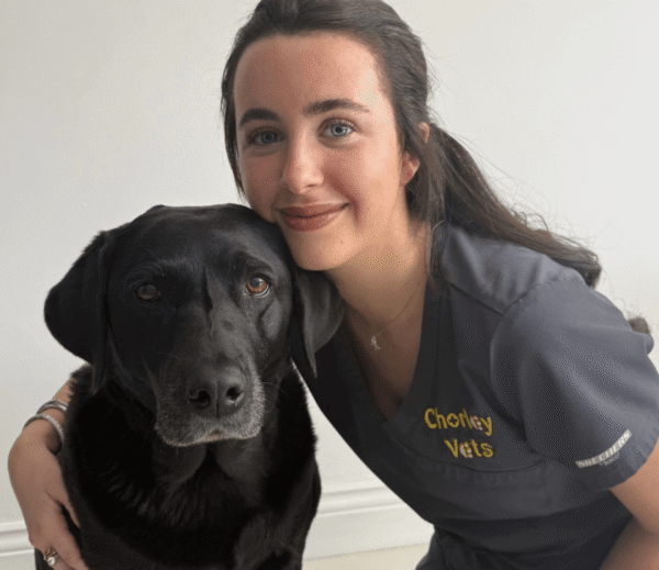 Jessica Sumner – Chorley Vets Receptionist with a black dog